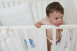 Baby boy in crib upset