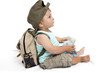 Baby boy with backpack and map
