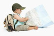 Baby boy with backpack and map
