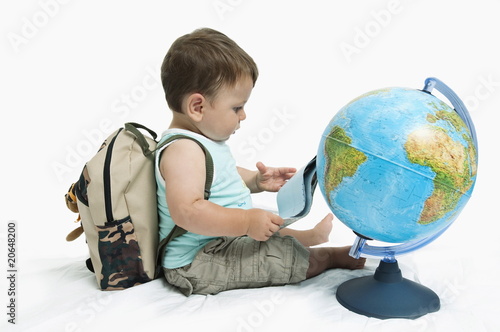 Photo: Baby boy with backpack and globe Baby boy with backpack and globe