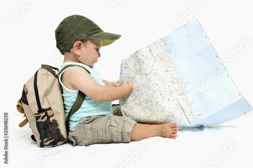 Photo: Baby boy with backpack and map Baby boy with backpack and map