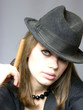 young lady in a cap and with a cigarette