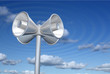 Chromed loudspeakers with sky background