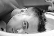Young attractive macho in bathroom