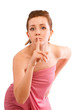 Young woman gesturing silence