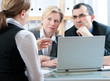 Foto: mid-adult couple meeting with financial planner mid-adult couple meeting with financial planner