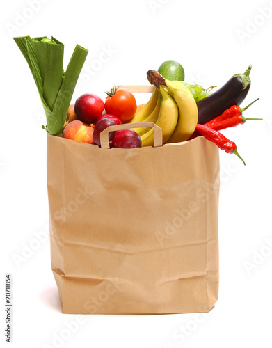 Photo: A grocery bag full of healthy fruits and vegetables A grocery bag full of healthy fruits and vegetables