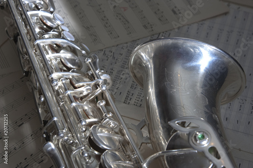 Photo: Saxophone and old sheet music Saxophone and old sheet music