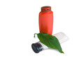 bottle of shampooand green leaves