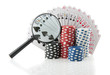 gambling chips and cards with a magnifying glass for casino game