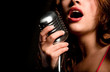 Beautiful singer singing with microphone