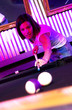 Young adults at a nightclub playing pool
