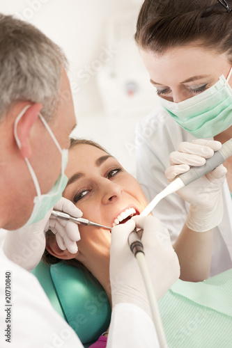 Photo: Patient with Dentist - dental treatment Patient with Dentist - dental treatment