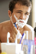 Young man shaving