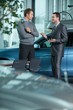 Car salesperson explaining car features to customer