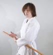 young man in a kimono with wooden sword