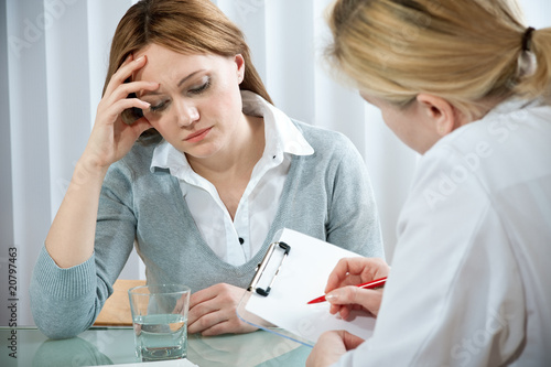 Photo: young woman in a conversation with the psychologist young woman in a conversation with the psychologist