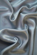 Smooth elegant grey silk as background Smooth elegant grey silk as background
