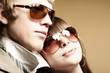 Fashionable young couple wearing sunglasses Fashionable young couple wearing sunglasses