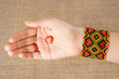 Chiromant's hand with whicky holding red heart