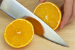 Photo: Chef Slicing Fresh Orange With Sharp Kitchen Knife Chef Slicing Fresh Orange With Sharp Kitchen Knife