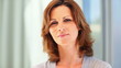 Cute mature woman smiling at you