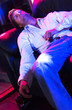 Young adult at a nightclub passed out