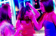 Young adults at a nightclub dancing