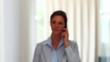 Beautiful mature woman talking on mobile and smiling