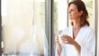 Mature woman drinking coffee in morning