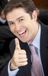 cheerful business man in his office