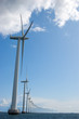 Windmills in a row on sunny weather, vertical