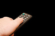 TV Remote control zapping isolated on black with space for text TV Remote control zapping isolated on black with space for text
