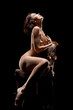 Photo: naked woman sitting on old chair naked woman sitting on old chair