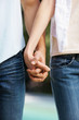 Mid section image of couple holding hands - Outdoors