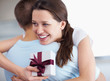 Affectionate female hugging boyfriend on her birthday