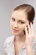 portrait of young woman in the office working talking on the pho