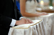 Groom's hands close-up during church ceremony