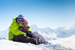 Young happy couple in winter mountains
