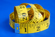 A measuring tape isolated on blue background