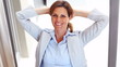 Mature business woman relaxing and smiling