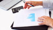 Business woman analyzing financial graphs