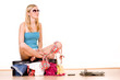Girl on suitcase packing Girl on suitcase packing