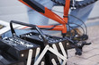 Closeup of an open tool box placed by a bicycle