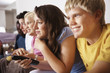 Relaxed teenagers watching television at home