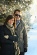 Young Couple Under Fir Trees Young Couple Under Fir Trees