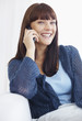 Foto: Happy young woman speaking on the cell phone Happy young woman speaking on the cell phone