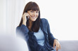 Foto: Pretty young teenage female using a cell phone Pretty young teenage female using a cell phone