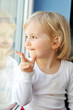 girl sits at window girl sits at window