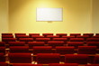 empty conference hall with screen. rows of a chairs